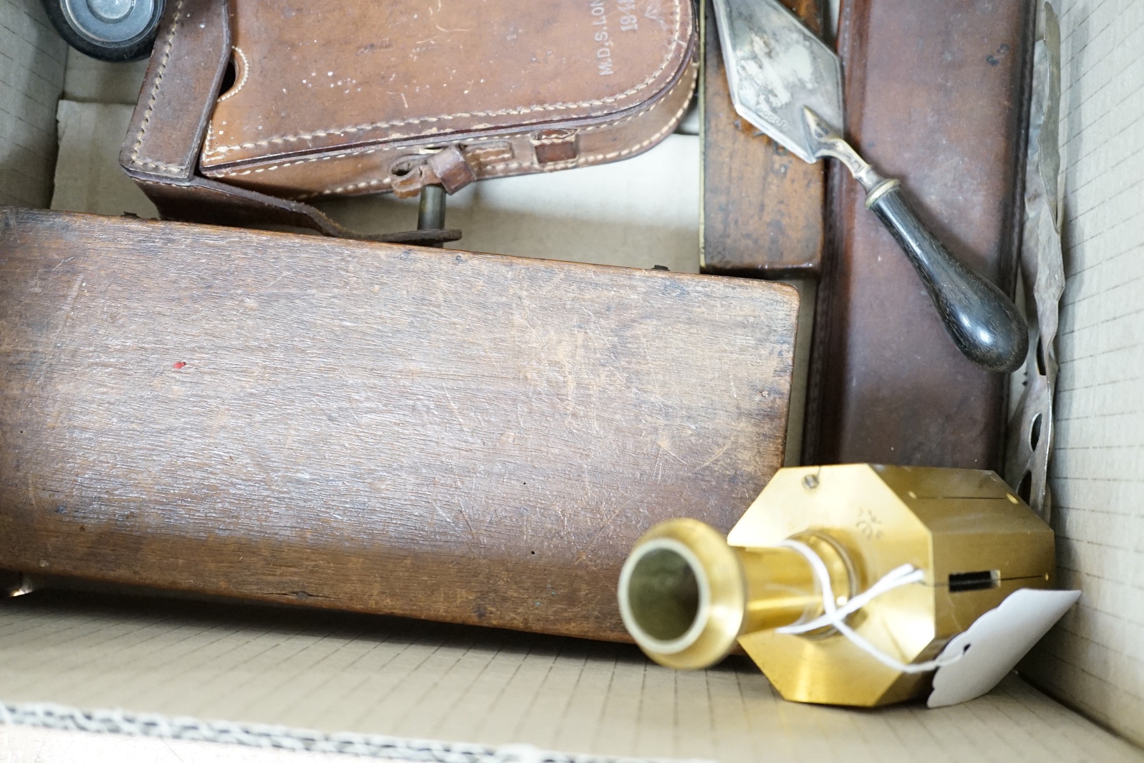 A group of surveying and scientific instruments, early 20th century, including and Elliot brothers London pocket sextant A in the Negretti and Zambra London compass, 80 Cook and Sons York and London level, military issue